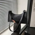 Black crocodile pattern baguette bag with glossy texture and minimalist shoulder strap - Stone Pattern Black