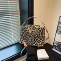 Women's leopard print PU leather handbag with V-shaped gold buckle and long shoulder strap - Yellow