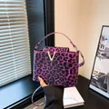Glossy leopard print handbag in purple and black with V-gold hardware and strap - Purple