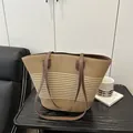 Handwoven straw tote bag in light brown with dark brown leather straps for summer - Off White