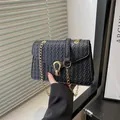 Minimalist black woven texture PU crossbody bag with golden U-shaped metal buckle - Black