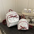 Set di zaini bianchi minimalisti con fiocchi rossi e pois per uso quotidiano - Grande / Blu