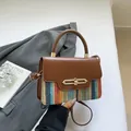 Brown leather handbag with colorful striped knit fabric and elegant gold chain lock - Brown