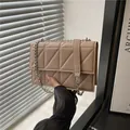 Quilted mini crossbody bag in beige PU leather with silver chain strap and flap design - Khaki