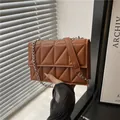 Brown quilted crossbody bag with diamond stitching and silver chain strap - Brown