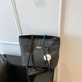 Large black woven tote bag with shoulder straps and white plush pendant for daily commute - With Pendant / Black