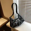 Retro black crescent shoulder bag in glossy faux leather with a large silver metal buckle - Black