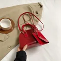 Red crocodile pattern shell handbag with mini pouch and gold hardware crossbody strap - Red