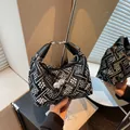 Chic black and white embroidered dumpling bag with geometric patterns and bead charm - Black