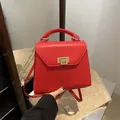 Elegant red faux leather square handbag with golden clasp and top handle for women - Red