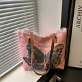Pink canvas tote bag with butterfly print and brown leather shoulder strap - Pink