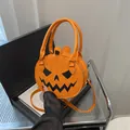 Fashionable orange pumpkin-shaped crossbody bag with spooky face for Halloween parties - Orange