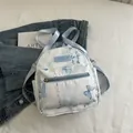 Mini mochila azul claro con diseño de mariposa y caligrafía con correas de nailon - Sin colgante / Azul