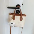 Beige contrast-color mini tote bag with brown handles and a cute plush doll charm - With Charm / Off White