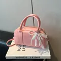 Pink PU leather Boston handbag with pearl lace bow charm and thin shoulder strap - With Pendant / Pink