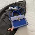 Blue striped canvas and navy matte leather crossbody bag with golden U-buckle detail - Blue