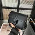 Classic black rectangular flap bag with large square buckle and gold hardware - Black