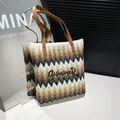 Summer straw tote bag with wavy stripes, embroidery detail and leather handles - Brown