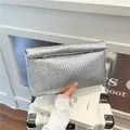 Silver metallic woven envelope clutch bag with intricate braided texture for women - Silver