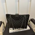 Quilted black leather tote bag with gold chain strap and square buckle detail - Black