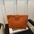 Caramel orange quilted tote bag with golden metal chain strap and minimalist square buckle - Brown