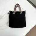 Large black canvas tote bag with multi-color striped strap and drawstring closure - Black