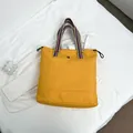 Large yellow tote bag with colorful rainbow straps and adjustable drawstring closure - Yellow