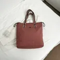 Brick red canvas tote bag with multi-color striped handles and side drawstring - Pink