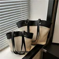 Ensemble de deux sacs cabas en paille tressée beige avec anses en cuir noir et anneaux - Noir Riz