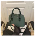 Dark green shell-shaped handbag with woven leather texture and detachable shoulder strap - Green