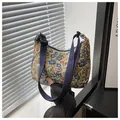 Floral jacquard crescent shoulder bag featuring blue and red flower tapestry pattern - Dark Blue