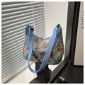 Floral print fabric shoulder bag with blue nylon strap and retro jacquard patterns - Light Blue