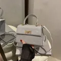 Silver glitter square handbag with golden twist lock and top handle for women - Silver