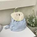 Sac à dos en toile bleu clair et beige avec design d'yeux cartoon et poignée verte - Bleu