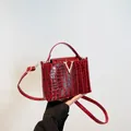 Dark red crocodile embossed leather tote bag with elegant gold V-shape metal buckle - Red