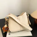 Creamy crossbody bag with FASHION buckle and cute brown monster plush charm - With Pendant / Off White