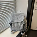 Light blue backpack with crinkled texture, Nika embroidery, and black side bow ribbons - Blue
