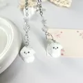 Lindo colgante de cachorro blanco con perlas de estrellas y cadena de plata para llaves - Perrito Estrella