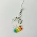 Artistic gradient goldfish phone charm with star beads and silver clasp on white background - Multicolor Koi
