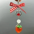 Sweet strawberry phone charm with red checkered bow and silver heart pendant detail - Gingham Bow Strawberry Style