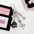 Y2K style beaded cat keychain with silver heart safety pin and pink star moon charms - Black