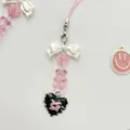 Pink heart bear beaded phone strap with white bow and heart pendants on white background - Heart Milk Bear Style 2
