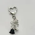 Silver bow keychain with heart clasp, featuring a black rose and lily of the valley charm - Rose Bow / Black