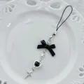 Porte-clés avec nœud noir et pendentifs étoile et croix argentés pour sac à main - Style Étoile Nœud