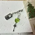 Lucky four-leaf clover phone chain with silver star and vintage key charm on stone - Clover Style