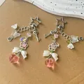 Ciondolo per telefono a forma di pesca rosa con chiusura a stella e fiocco decorativo - Ciondolo Pesca e Fiocco