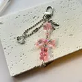 Ciondolo per cellulare rosa con orsetto sfumato, fiocco e cuore Made with Love - Portachiavi
