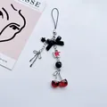 Handmade cherry phone charm with black bow and red beads on a clean white background - Black Bow Cherry Style (1)