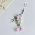 Handgefertigter Handy-Anhänger mit weißem Stern, Perlen und kleinen silbernen Schleifen - Stern Maiglöckchen Stil / Rosa