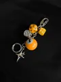 Detailed shot of dice keychain with orange billiard ball and silver star charms - Bright Orange-Yellow Billiard Style / Yellow 1-Ball Combination (5959330435418)